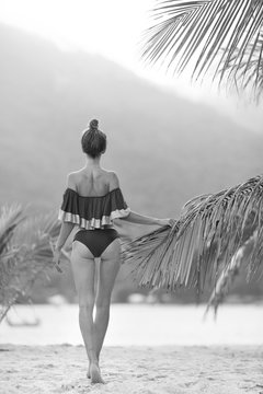 Beautiful sexy slim girl on the beach. Black and white photo