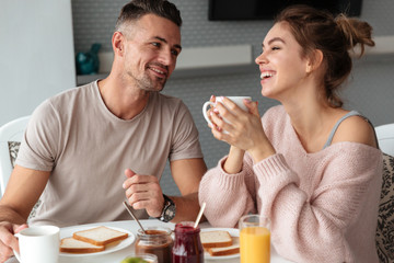 Portrait of a happy loving couple having breakfast