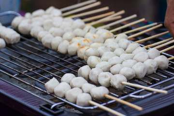 Thai Street Food, Grill pork balls pour and delicious on the market Bangkok Thailand