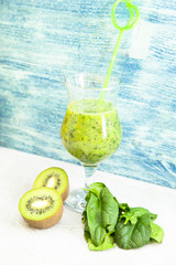 Energy for the whole day with fresh green smoothie with kiwi, banana and spinach. Healthy food, Diet, Fitness concept