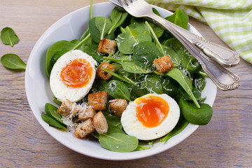 Boiled egg with toasted bread, spinach and parmesan cheese for breakfast. Breakfast meal, horizontal