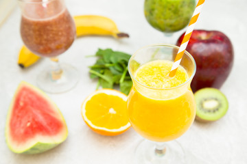 Energy and freshness for the whole day with fruit and berry smoothies with fresh kiwi, banana, orange, apple and spinach. Healthy food, Diet, Fitness concept
