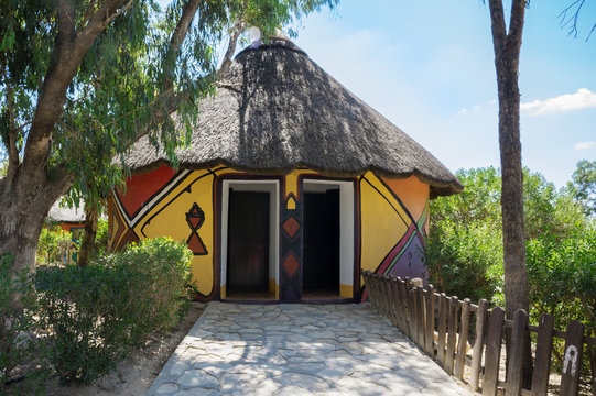 round house with a reed roof in the African style.