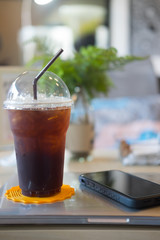 Iced americano and mobile phone