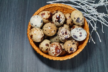 Quail eggs in a basket  - Easter composition.Easter Tradition - Selective focus
