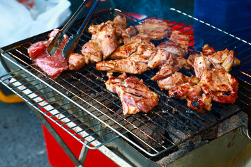 Grilled pork on the grill.