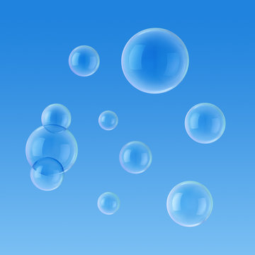 Soap bubbles on the background of blue sky