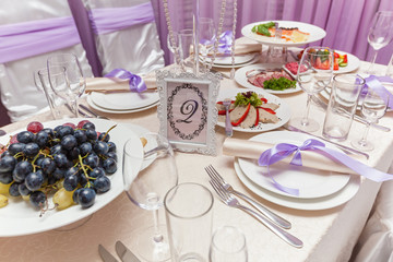A decorated wedding table with room number eight. Served wedding table.