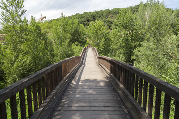 Fototapeta na wymiar Landscape with wooden bridge in Garrotxa region,Castellfollit de la Roca,Catalonia,Spain.