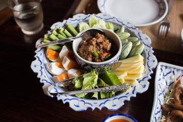 Thai food name Naam Phrik Lohng Reuua (Boat Embarking Chili Relish) is relish of fermented shrimp paste sauce with sweet pork condiment, crispy deep fried fluffy fish, salted eggs and vegetables. 