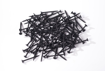 lot of black screws on a white background