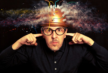 Man crazy inventor wearing a helmet brain research