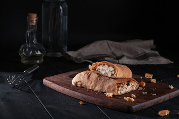Hearty Homemade Chicken Pot Pie on black wooden