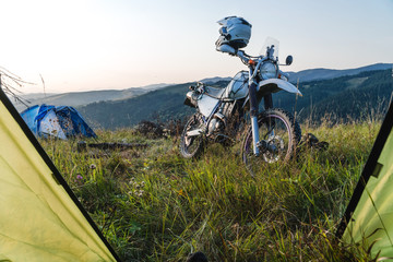 Landscape outside tent view mountans, enduro motorcycle travel