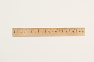 A wooden ruler on a white background