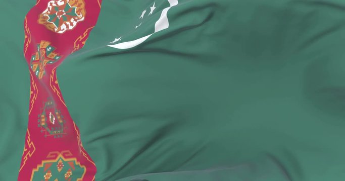Flag of Turkmenistan waving at wind in slow with blue sky, loop