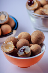 Longan fruit; in a plate; on; white; background.