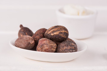 Shea butter nuts on a white table