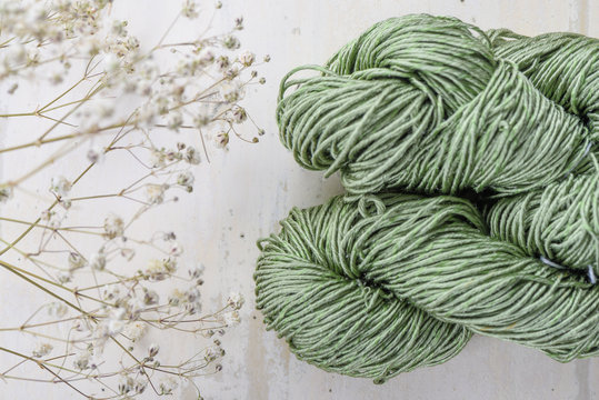 Precious silk yarn on a white table