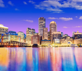 The Boston skyline at night, located in Fan Pier Park, Boston, Massachusetts, USA.