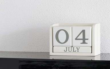 White block calendar present date 4 and month July