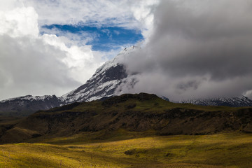 Obraz na płótnie Canvas South peak of Antisana volcano that hides in the clouds