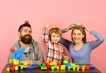 Little boy, bearded man and young woman having fun