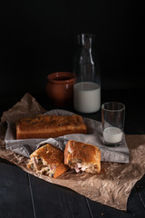 Homemade mini bread with fillers on dark wooden surface