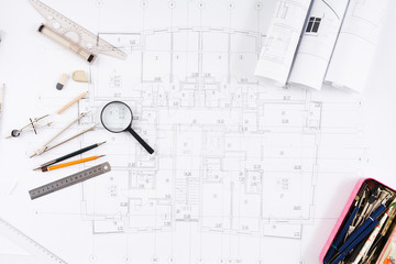 Architectural project, engineering tools on table.