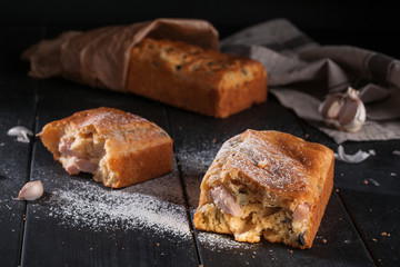 Homemade mini bread with fillers on dark wooden surface