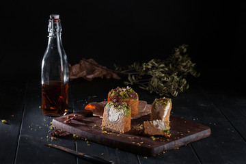 Homemade carrot cakes with pecans on dark wooden