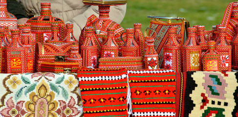 street selling of a handmade souvenirs with traditional macedonian colors in ohrid,macedonia - obrazy, fototapety, plakaty