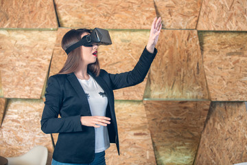 Girl using VR glasses having fun