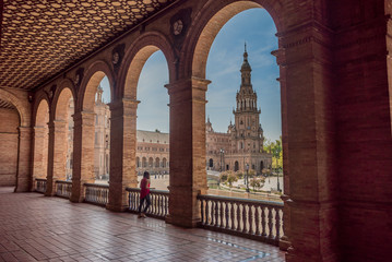 Fototapeta premium Young woman latina tourist visiting Plaza España in Seville
