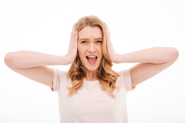 Fototapeta premium Confused screaming young displeased woman