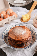 Chocolate Pancake with powdered sugar