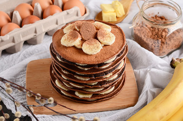 chocolate pancakes with bananas on top