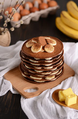 chocolate pancakes with bananas on top