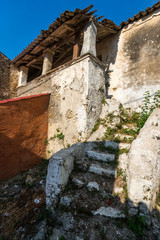 Stairs to abandoned typical house in Corfu, Greece.