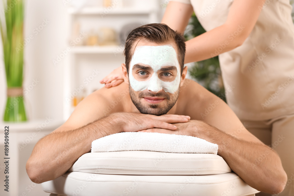 Canvas Prints Young man having massage in spa salon