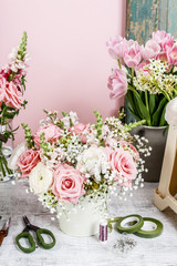 Bouquet of flowers and florist's accessories.