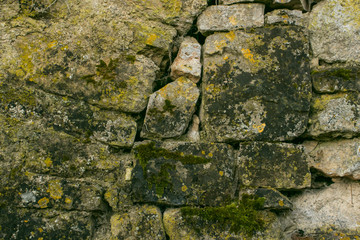 Texture from the pattern obtained from the folded stones in the masonry when building an old stone house.
