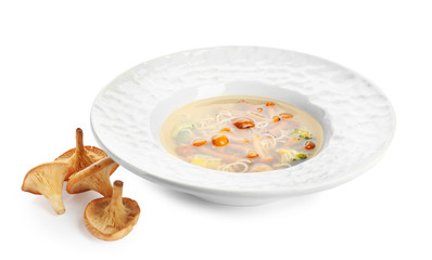 Plate with mushroom soup, isolated on white