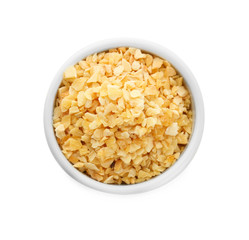 Bowl with granulated dried garlic on white background