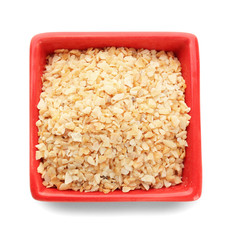 Bowl with granulated dried garlic on white background