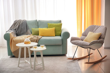 Living room interior with comfortable couch and soft pillows