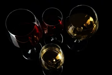 Fototapete Alkohol Glasses with different wine on black background