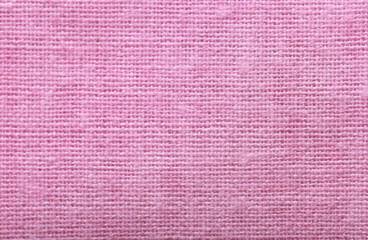 Pink cotton fabric texture as background, closeup