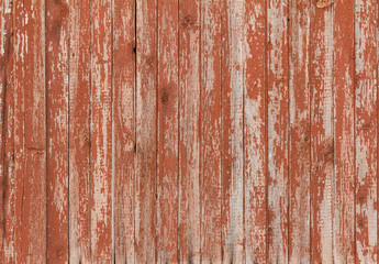 Background of old wooden board with cracked red paint