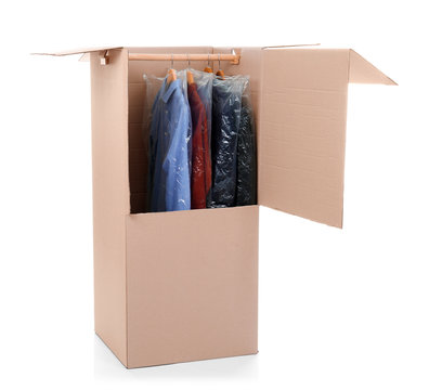 Wardrobe box with clothes on white background